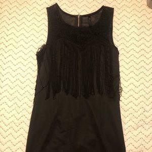 Black mini dress with fringe.